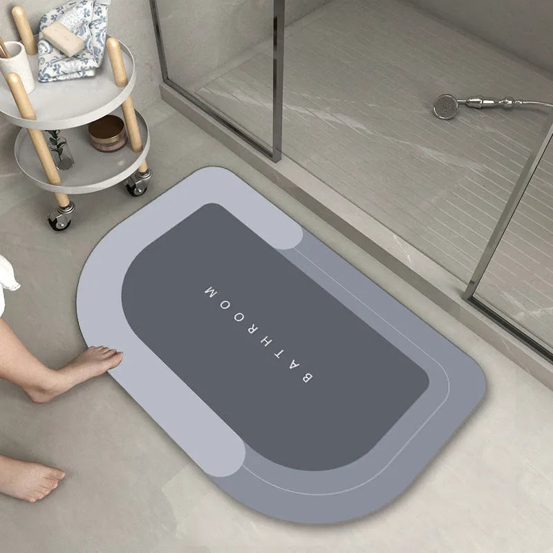 Bathroom floor mat in blue colour, oval shape, showing machine-woven blended texture