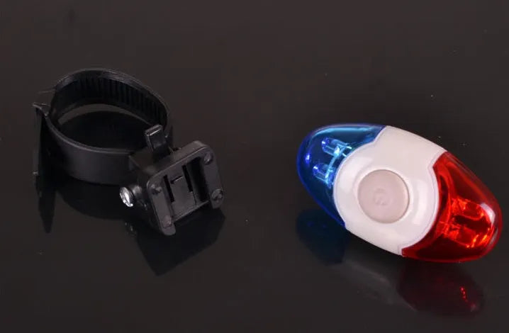 Red and blue LED bicycle tail light with adjustable mounting base.
