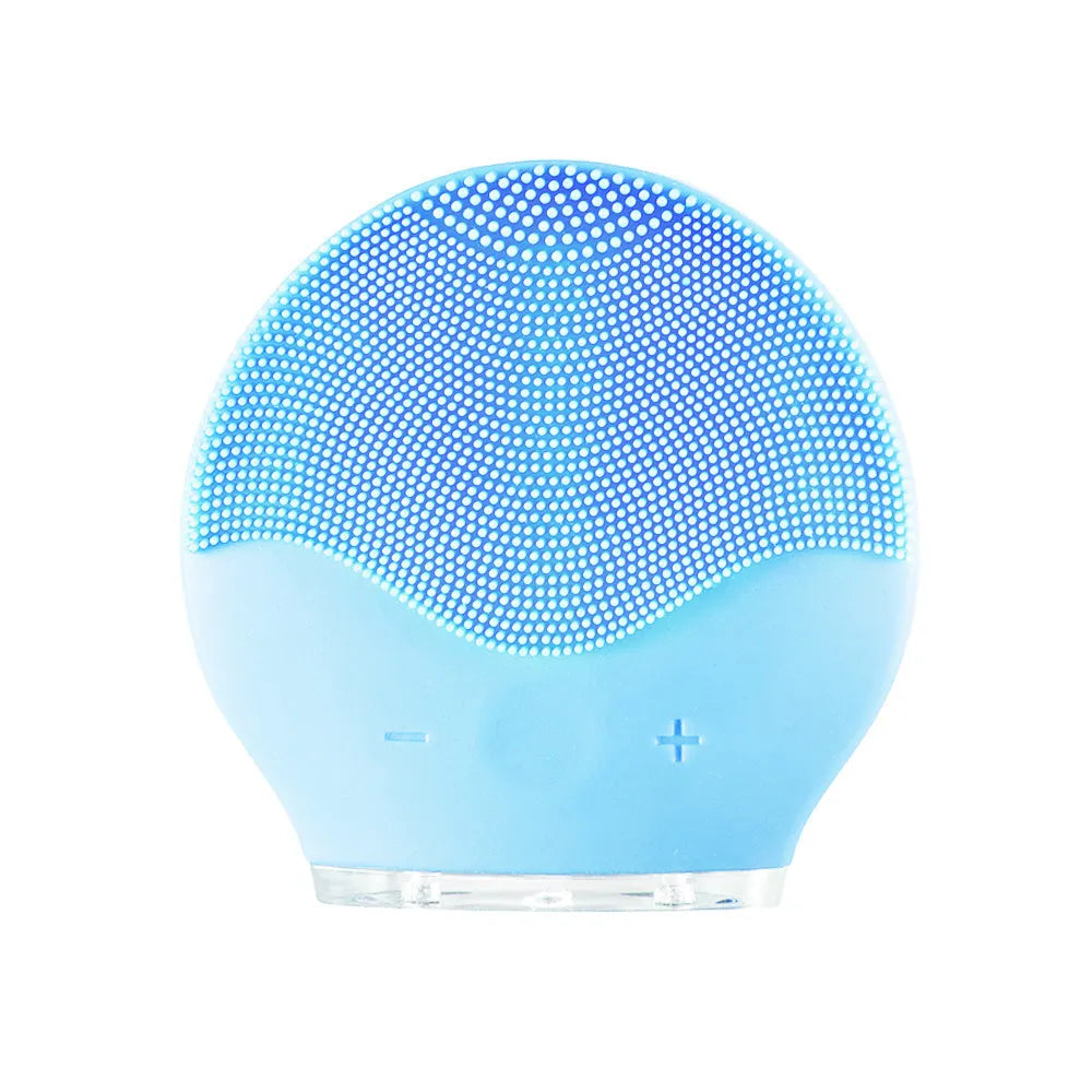 Electric waterproof silicone mini facial cleansing brush in pink with USB charging cable