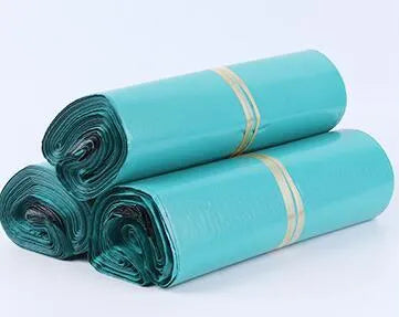 Bundle of 100 clear PE plastic courier clothing bags in multiple sizes with adhesive sticker seals.