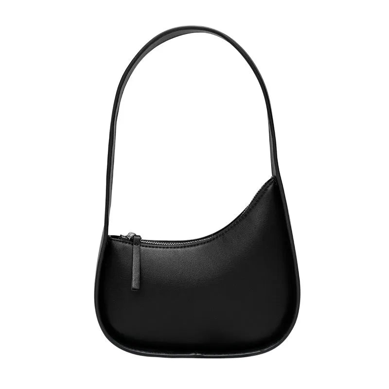 Small brown leather crescent shaped women's shoulder bag with wide strap