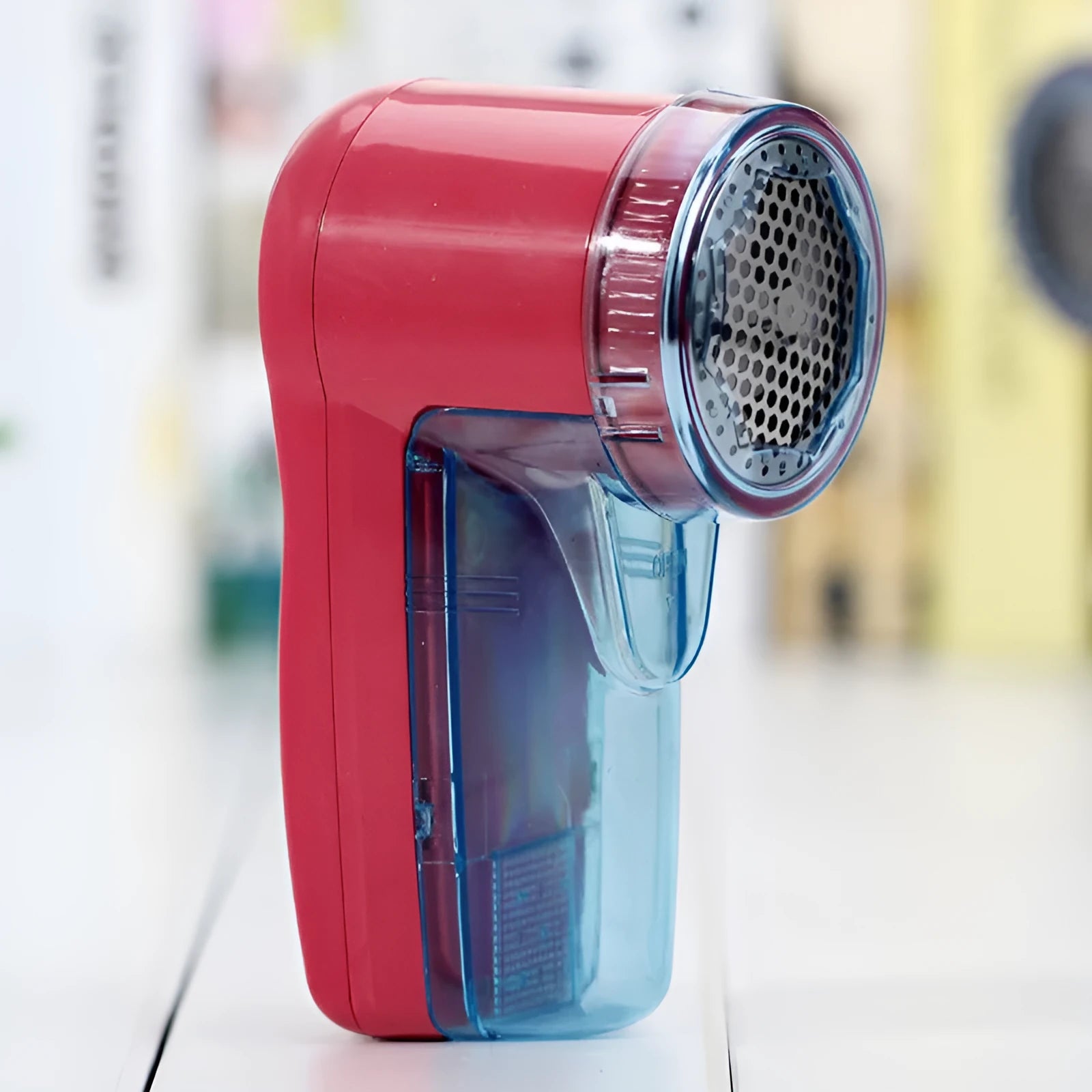 Portable electric clothing lint remover with compact rectangular design showing dimensions
