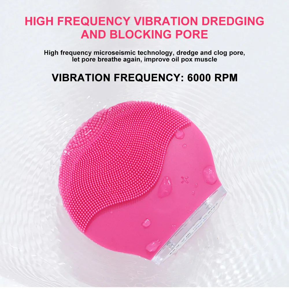 Electric waterproof silicone mini facial cleansing brush in pink with USB charging cable