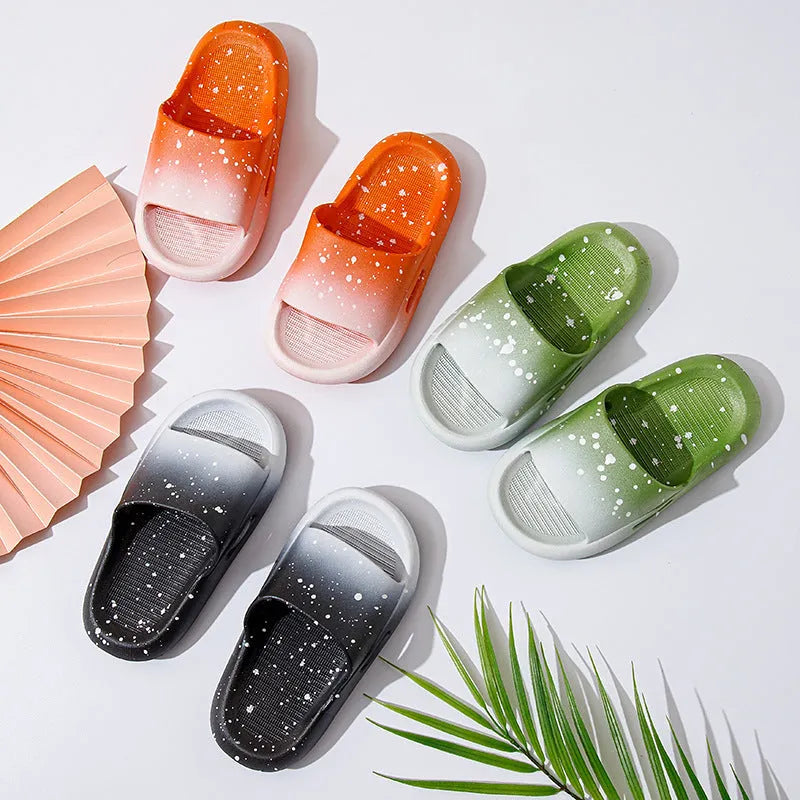 Gradient coloured PVC slipper sandals for children on a white background.