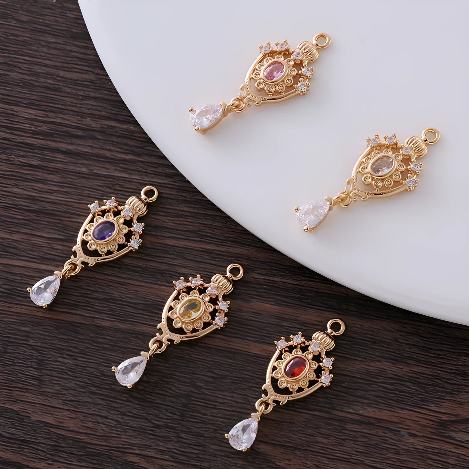 Small hollow water drop pendant with zircon accents in one of five colours.