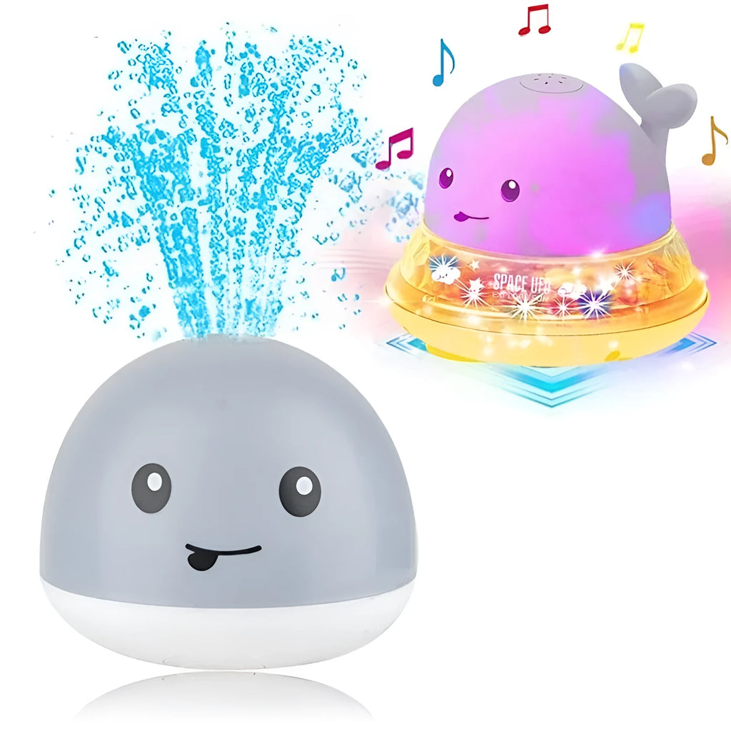 White and blue whale-shaped electric bath toy spraying water with coloured lights flashing
