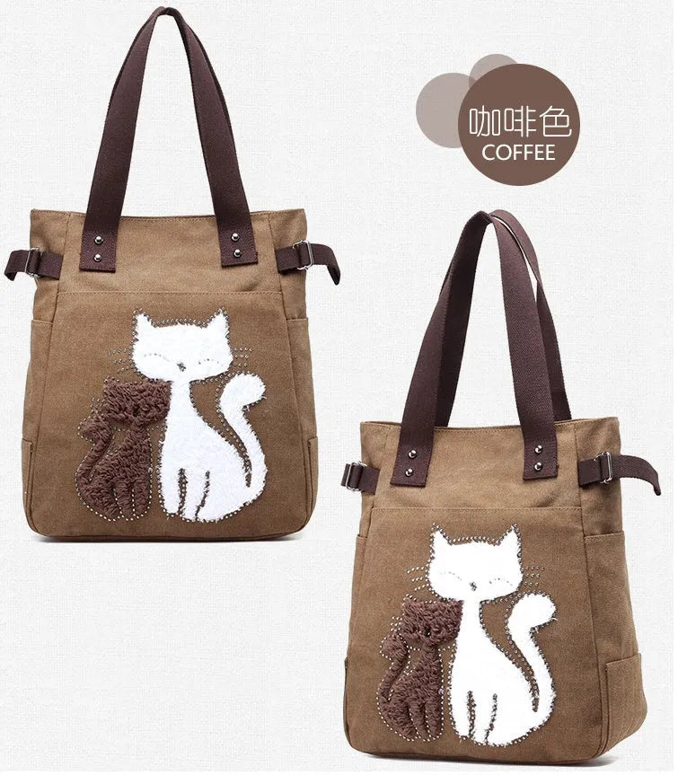 KVKY canvas handbag with plush cat applique in beige colour on a woman's shoulder