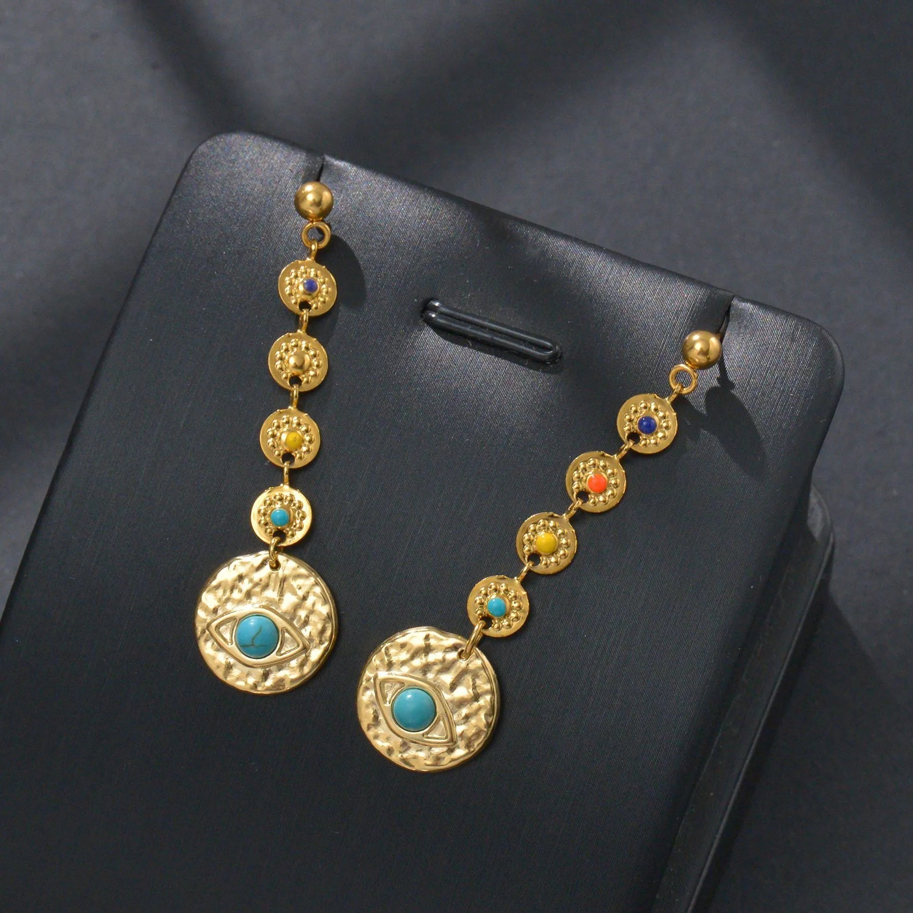 Stainless steel geometric personality earrings showing Eight Awn Star, Eye, and Shell Sun designs.
