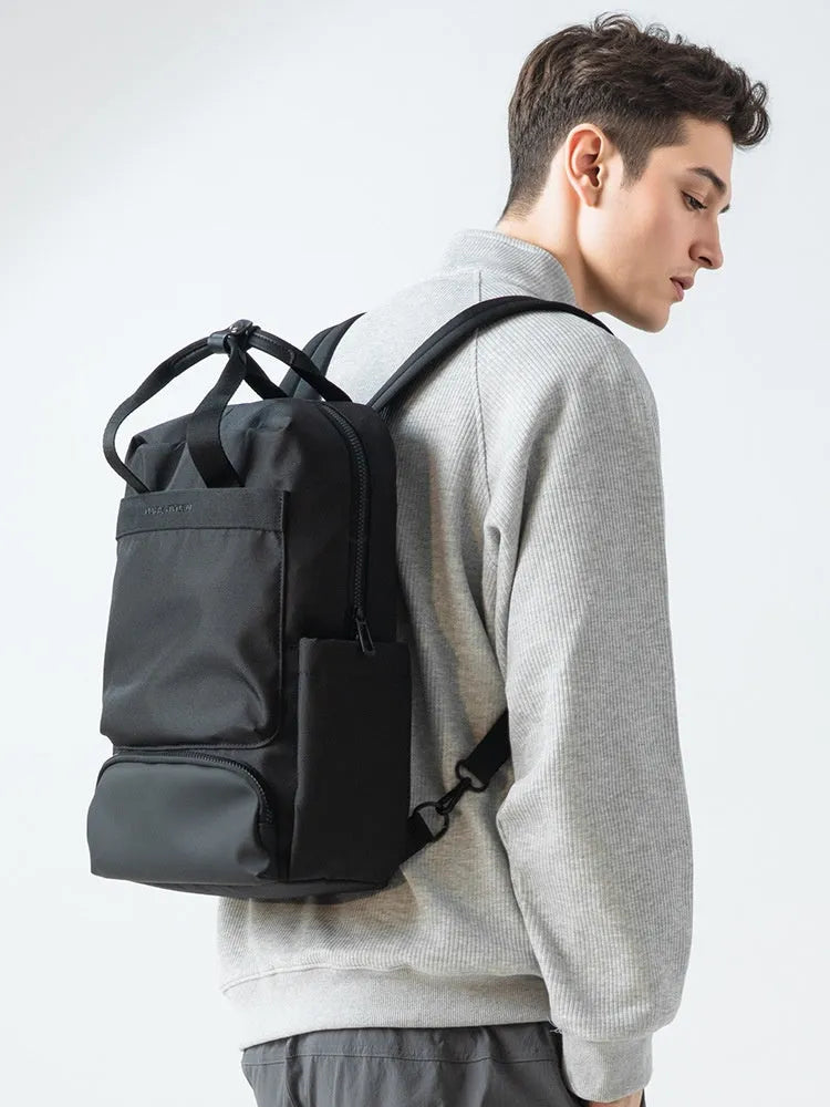 Black oxford cloth computer backpack with a 20-35 litre capacity and polyester lining.