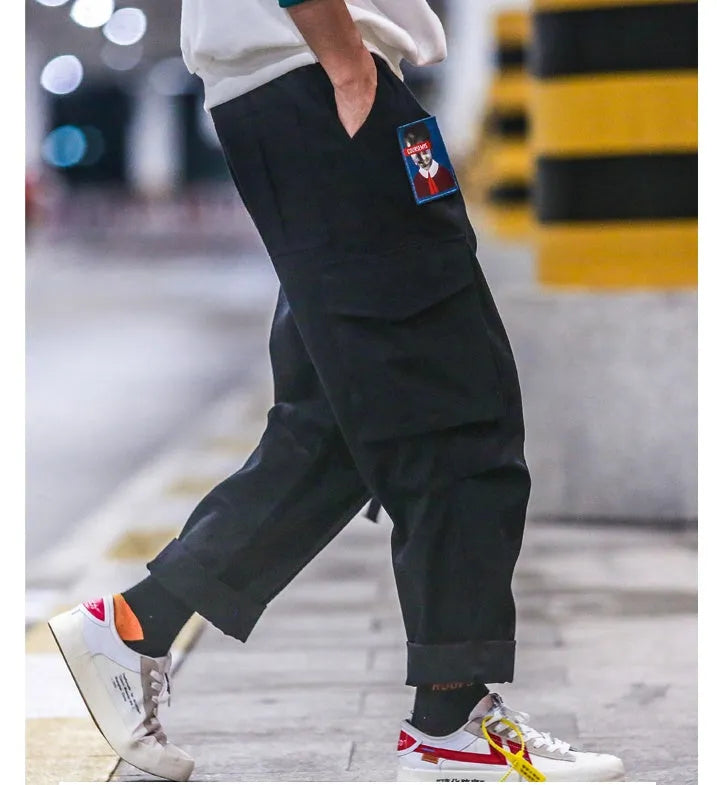 Influx men's loose fit Harajuku style cargo trousers in black with drawstring waist