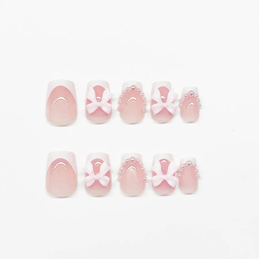 Short French manicure nail art set with multiple patterns including tulips, bows, starry sky, leopard print and XINGX designs