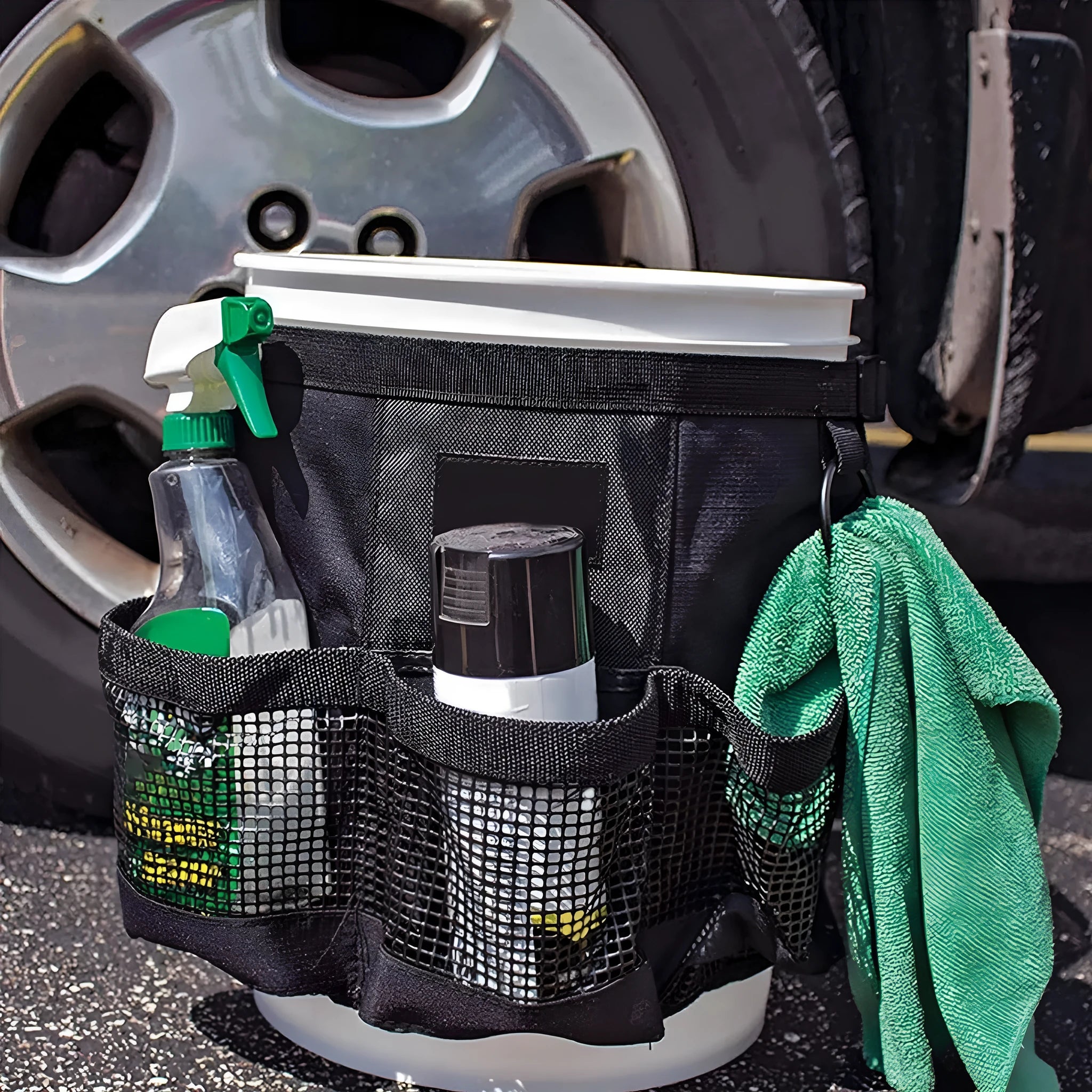 Black cylindrical waterproof polyester storage bag hanging with car washing tools and fishing equipment