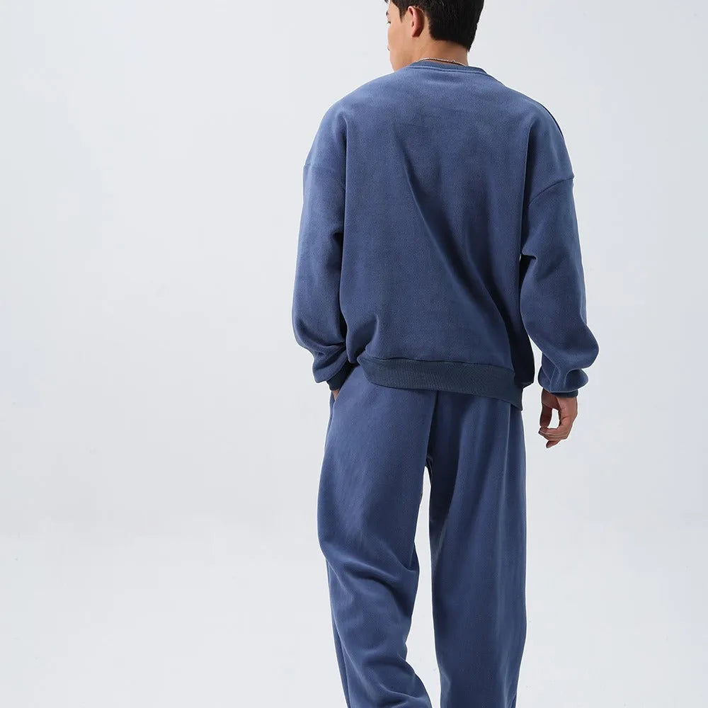 Men's polar fleece sports suit set showing jacket and trousers in winter colours