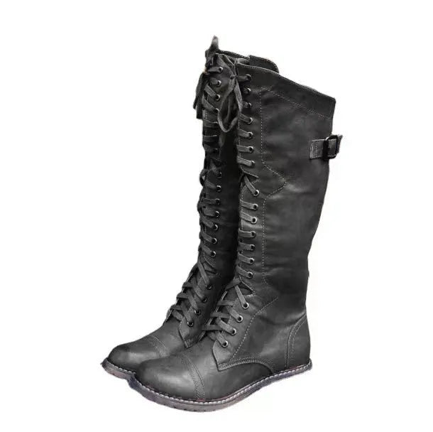 Women's black casual high-leg boots with a chunky low heel and round toe.