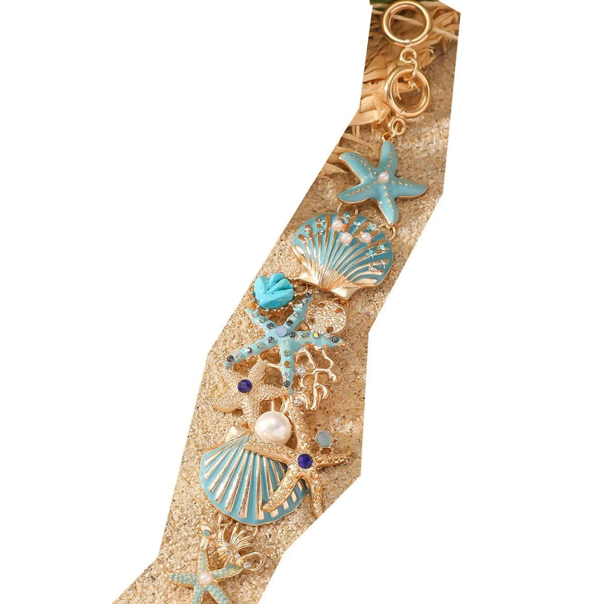 Women's alloy bracelet with starfish and boat anchor rhinestones in turquoise, red, or blue.