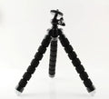 Black flexible octopus tripod with wrapped legs showing 1/4-20 screw mount for smartphones
