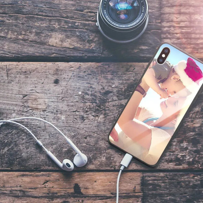 Slim hard back patterned case for iPhone with raised edge protecting camera and screen.