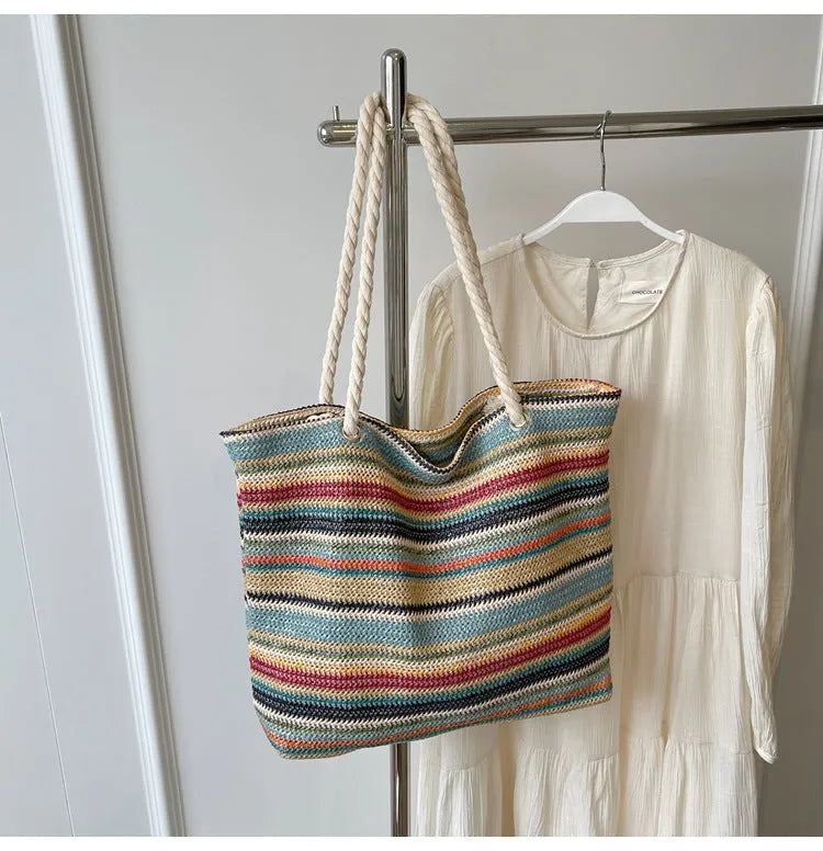 Blue straw woven large shoulder bag with an adjustable nylon strap