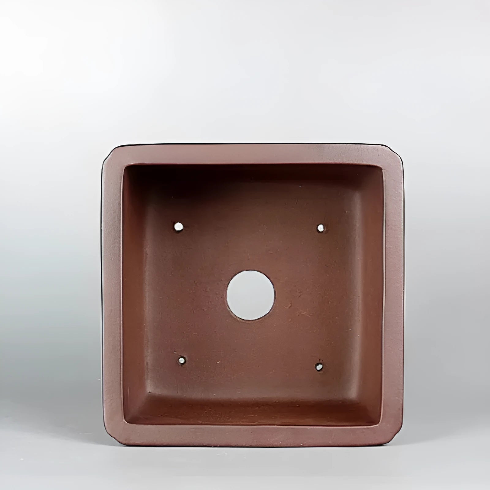 Brown handmade antique purple clay flower pot measuring 19x19x11.5 cm