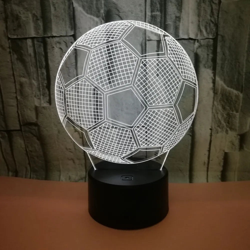 3D football-shaped acrylic night light glowing in blue with a black ABS base and remote control.