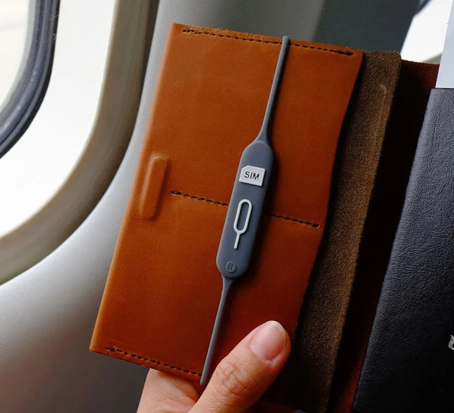 Silicone card holder showing open design with card storage positions in green grey colour