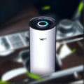 AB-8830 white matte ABS car air purifier with negative ion function placed in cup holder