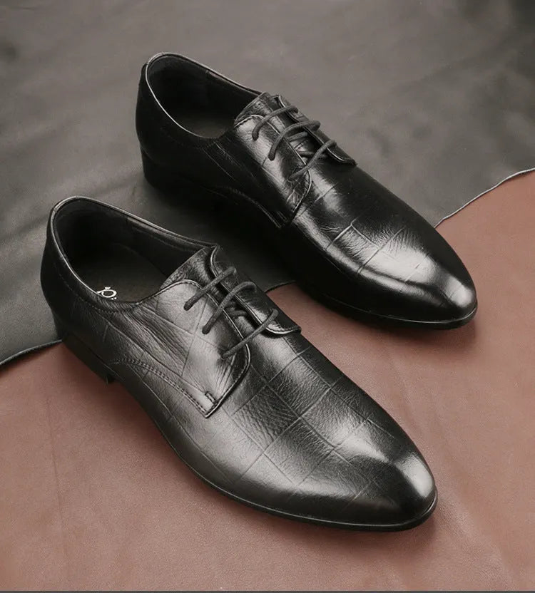 Men's black checkered leather derby shoes with a pointed toe on a rubber sole