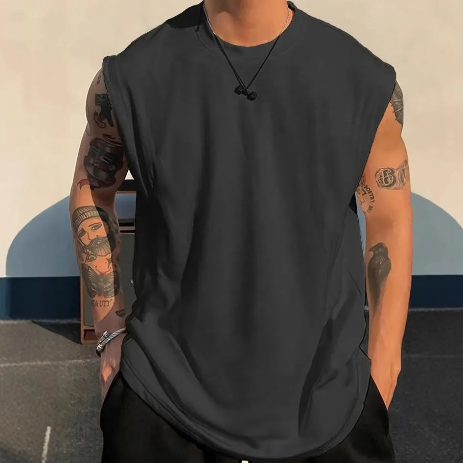 Men's solid colour loose sleeveless cotton tank top on a hanger, shown in apricot colour.