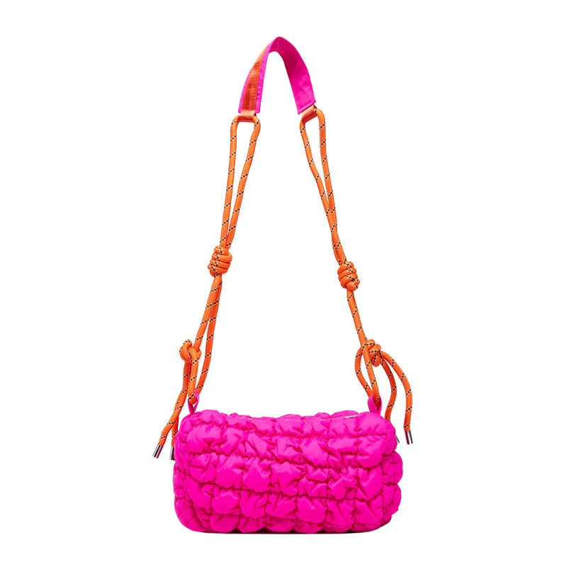 Women's soft nylon pillow-shaped messenger bag with diamond quilting and a crossbody strap.
