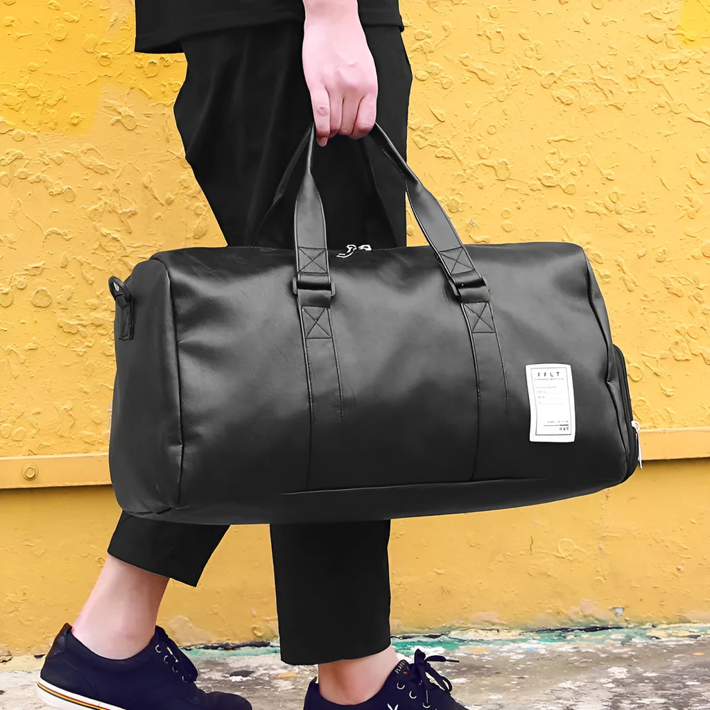 Black waterproof sports bag with separate side shoe compartments and a diagonal shoulder strap