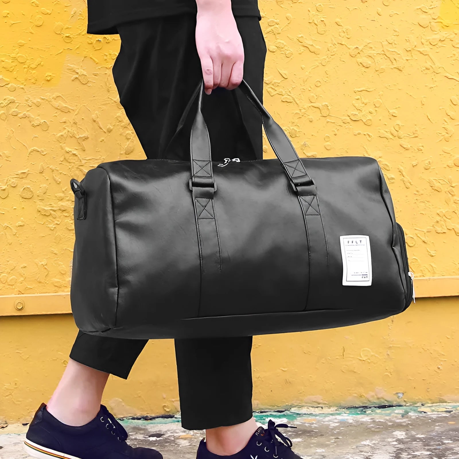 Black waterproof sports bag with separate side shoe compartments and a diagonal shoulder strap