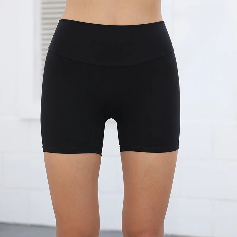 Women's high waist sport shorts in avocado green colour with pockets, on a mannequin.