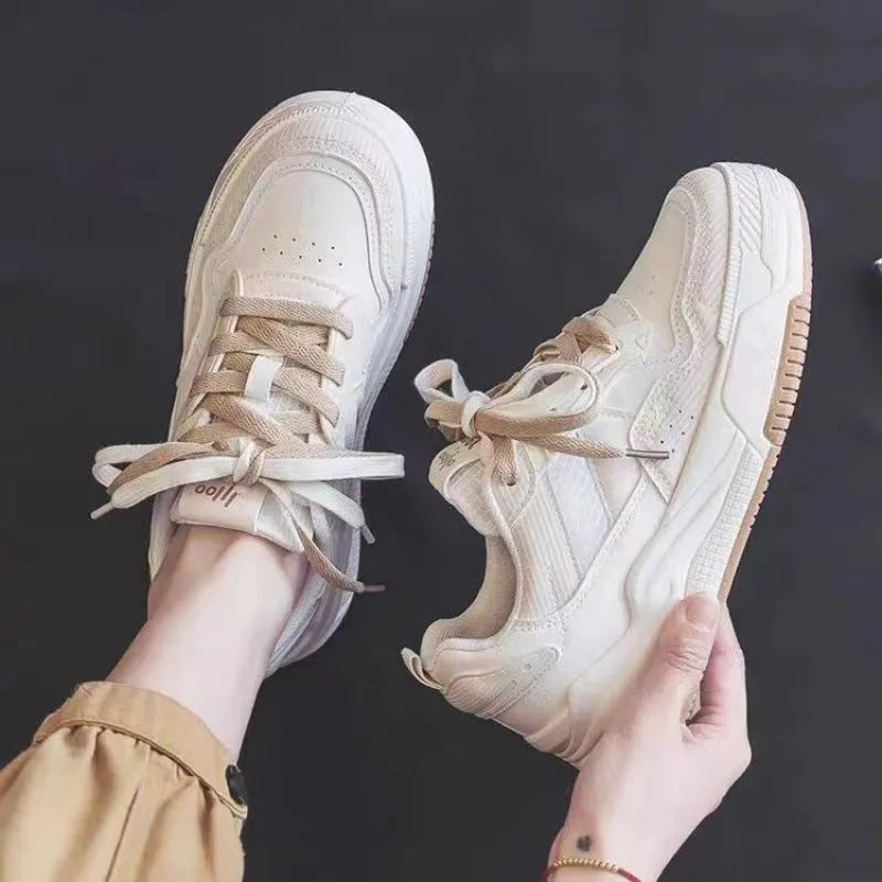 Women's pink and white low-top rubber sneakers with height increasing soles