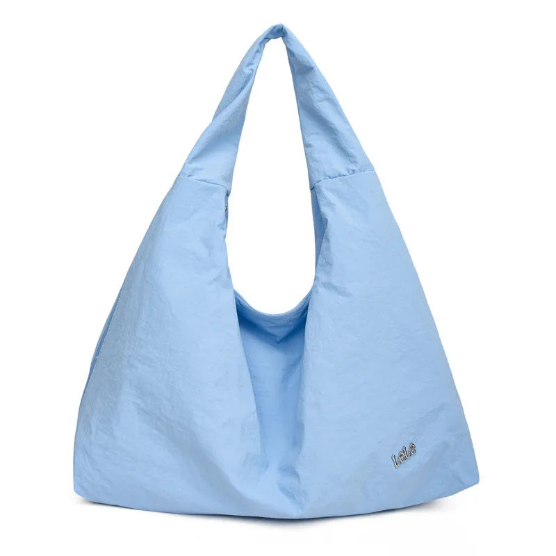 Nylon underarm bag in heart shape design showing large capacity, available in black, blue, khaki, and yellow colours