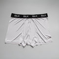Men's loose fit silk shorts in navy blue, shown in a casual setting