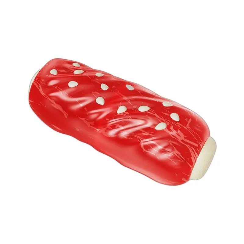 A primary-colour plastic molar rod dog chew toy with textured surfaces and a treat cavity.