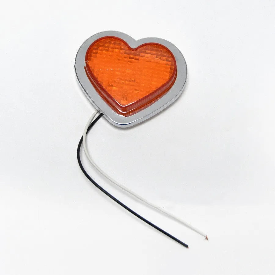12V heart-shaped red LED automotive sidelight for fender mounting on a car.