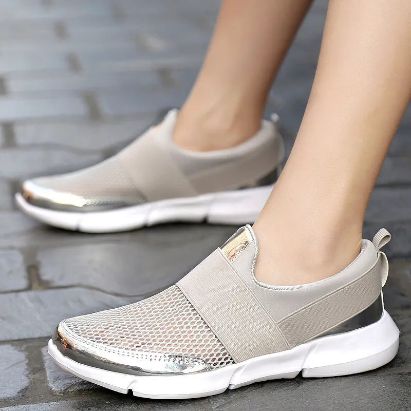 Women's low-top casual sneakers in blue, featuring a breathable mesh interior and a colour-matching pattern.