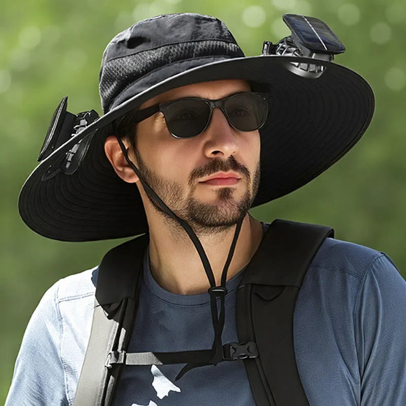 Man wearing a beige solar-powered fan hat with a neck flap outdoors.