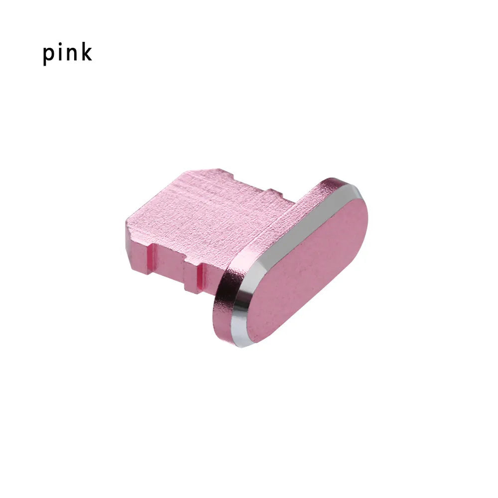 Aluminium alloy iPhone charging port dust plug in metallic colours on a dark background.