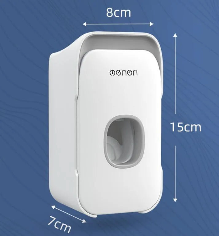 Automatic toothpaste dispenser unit mounted on a wall in a choice of blue, grey, or pink colours.