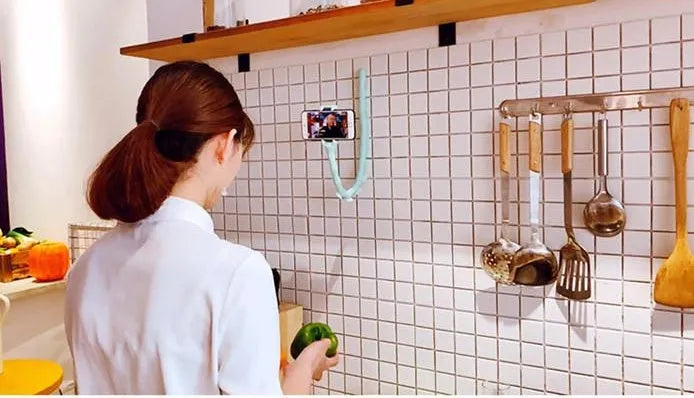 Black flexible rubber phone holder with long 62cm arm and suction cup, holding a mobile phone at an angle.
