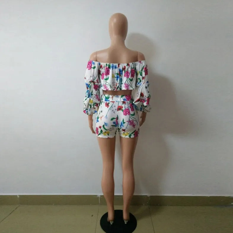Multicolour digital print two-piece costume with fluffy sleeves and matching shorts.