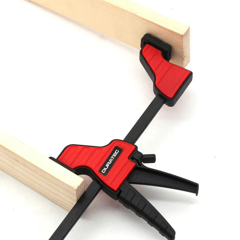 Black engineering plastic woodworking clamp with rubber grip and regression adjustment key