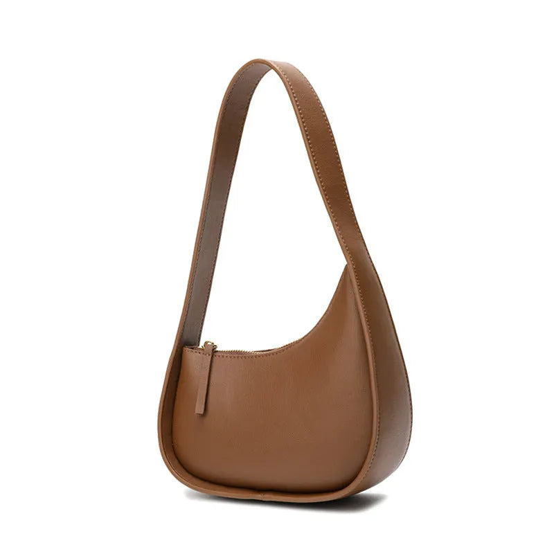 Small brown leather crescent shaped women's shoulder bag with wide strap