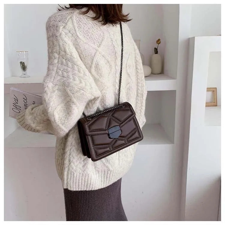 Small square PU shoulder bag with gold rivet studs, chain handle and zipper closure, available in four colours