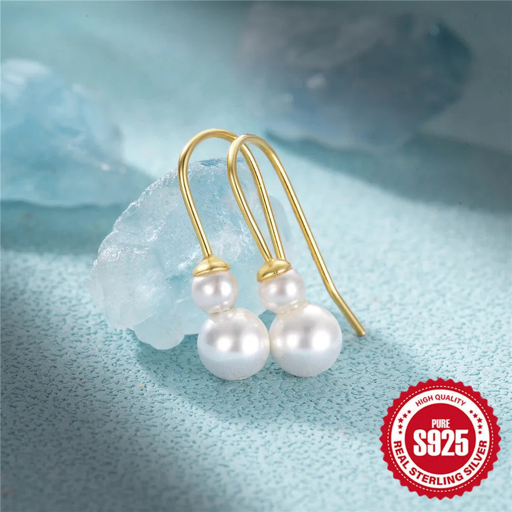 S925 sterling silver women's earrings with geometric sunflower design and golden zircon inlay.