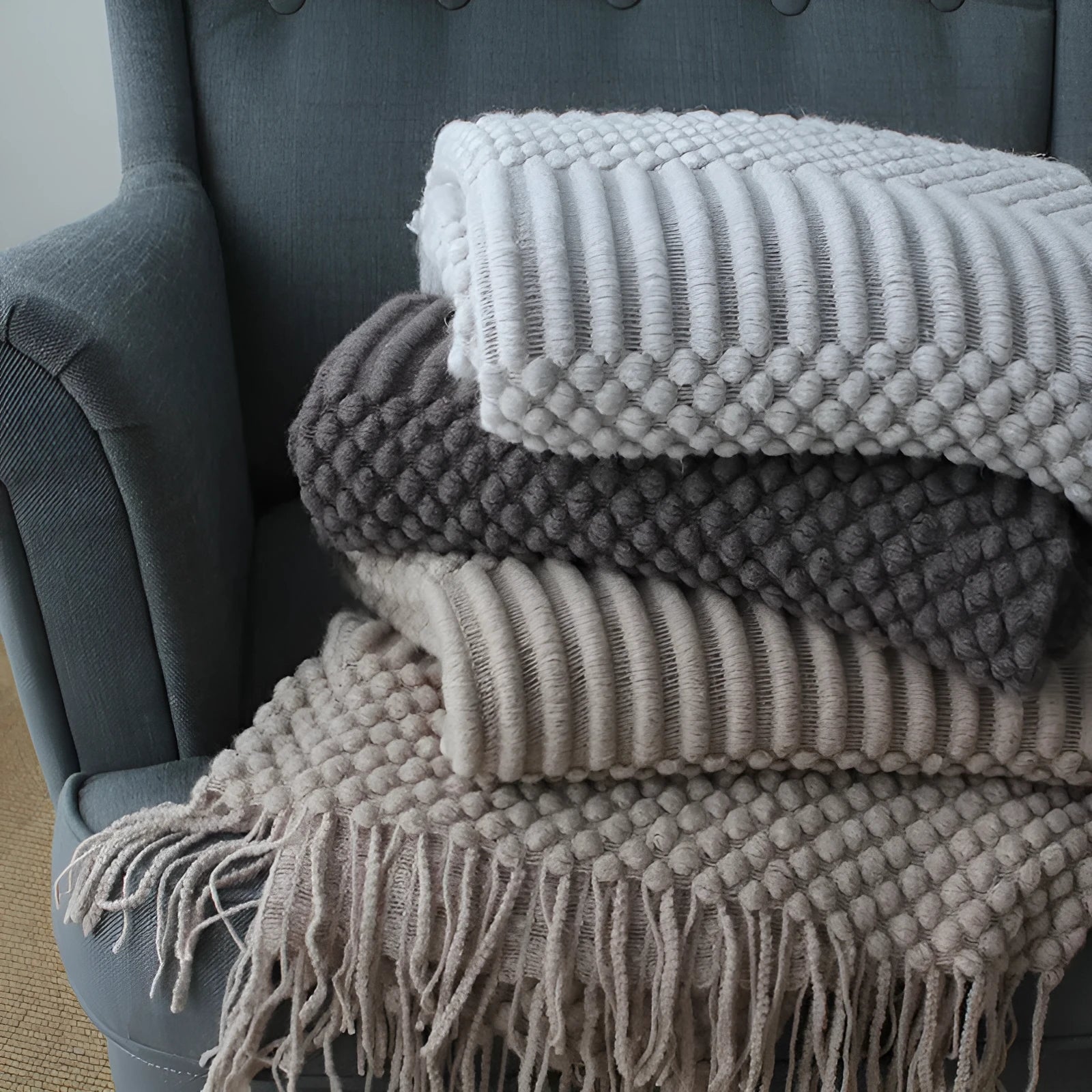Small 127cm by 170cm polyester nap blanket shown in dark grey, khaki, and light grey colour options.
