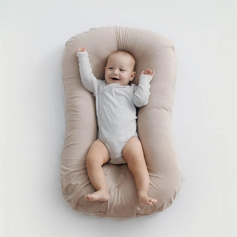 Beige portable cotton baby nest crib for newborns measuring 75cm by 45cm