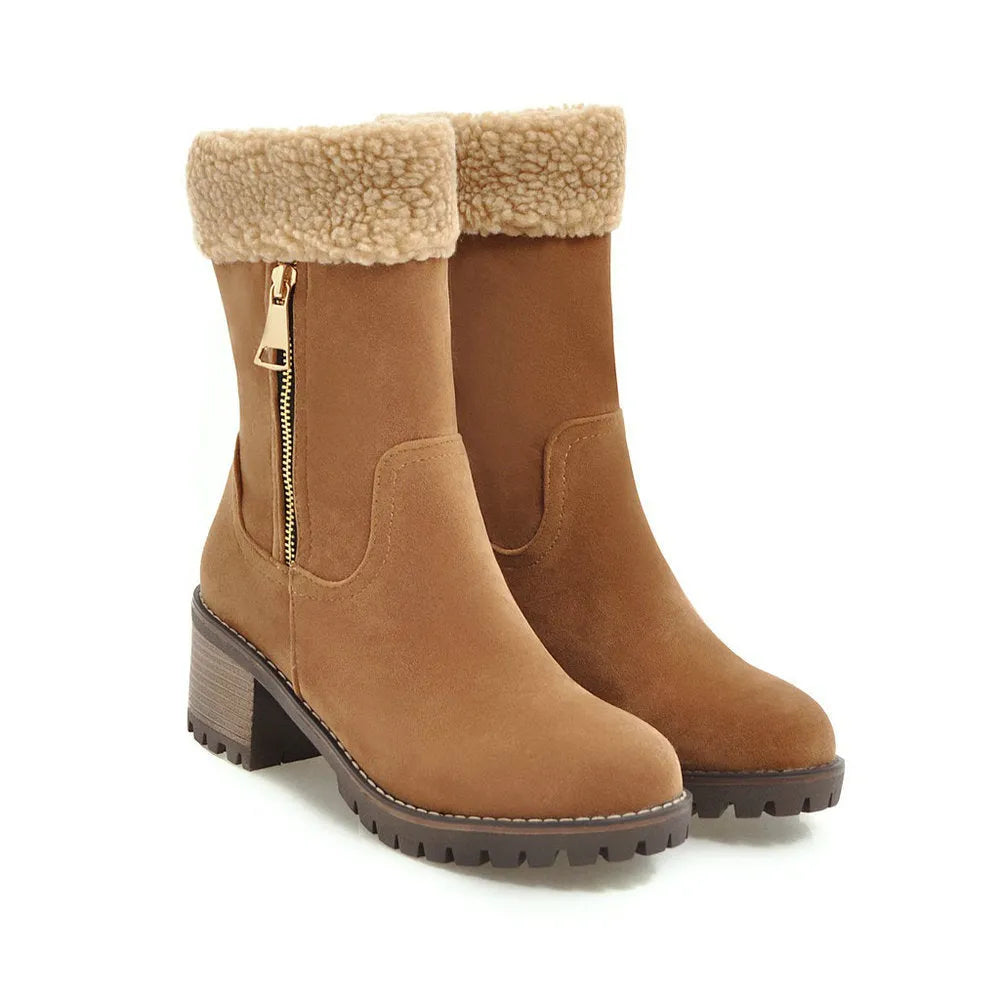 Men's black waterproof snow boots with thick rubber sole and plush lining on a snowy background.